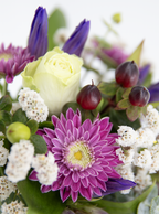Small arrangement of minature rose bud, chrysanthemum and berries.